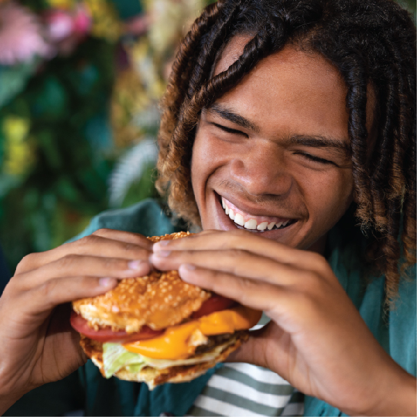 Student enjoying a MOF burger